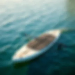 A sleek battery-powered paddle board gliding across calm waters