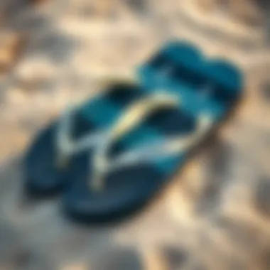 Stylish Beach Flip Flops Stylish surfer flip flops laid out on a sandy beach, emphasizing their fashionable appeal.
