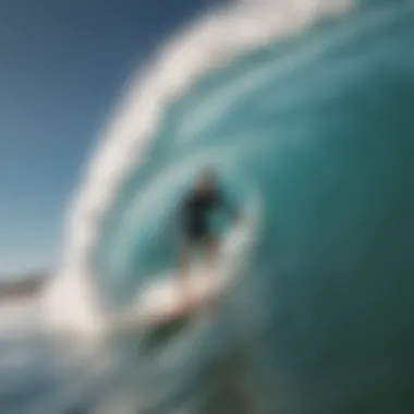 Surfer riding a big long board on a perfect wave