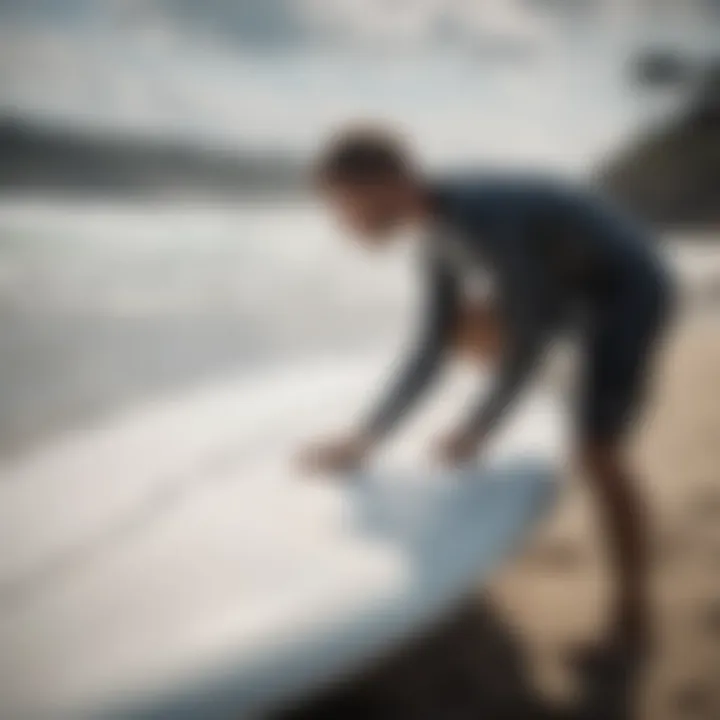 Application of fiberglass resin on a surfboard