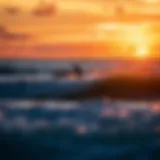 A breathtaking sunset over a Costa Rican beach with surfers riding the waves