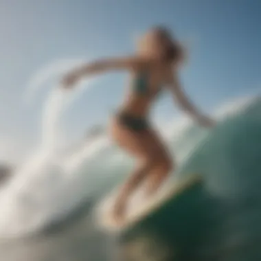 Surfer catching a wave in stylish bikini