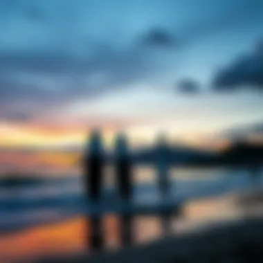 A serene sunset view with paddle boards on the shoreline.