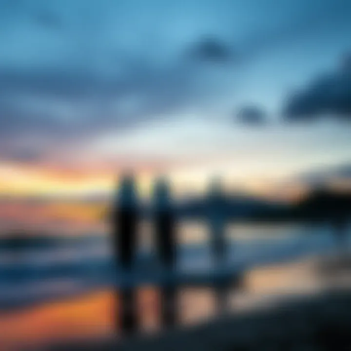 A serene sunset view with paddle boards on the shoreline.
