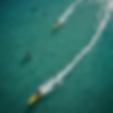 A breathtaking aerial view of kitesurfers gliding over turquoise waters