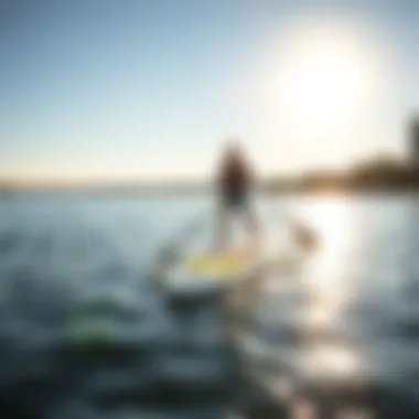 Paddle Boarder on a Sunny Day at Lake Austin Paddle boarder enjoying a bright day on Lake Austin