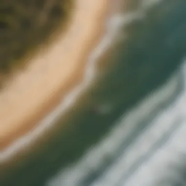 Aerial view of kite surfers navigating the coastline