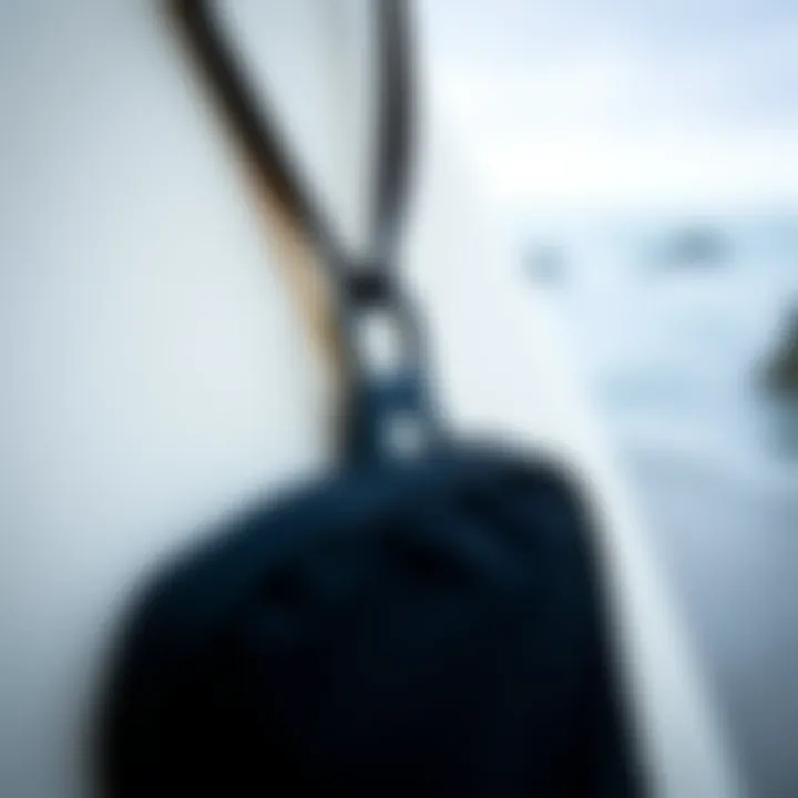 Detailed View of the Key Pouch Close-up of waterproof key pouch with surfboard in background