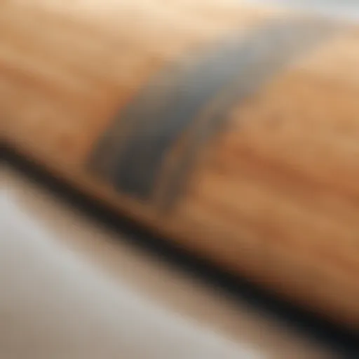 Close-up view of a traditional wooden surfboard showcasing craftsmanship