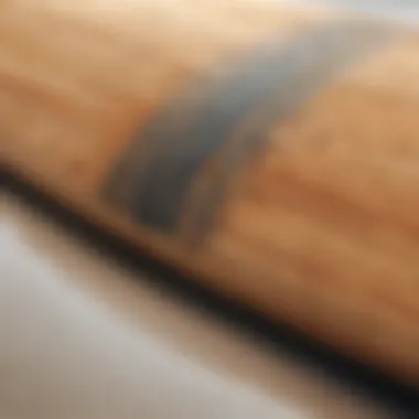 Craftsmanship of Traditional Surfboards Close-up view of a traditional wooden surfboard showcasing craftsmanship