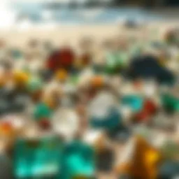 A close-up view of shimmering glass fragments on a beach, reflecting sunlight.