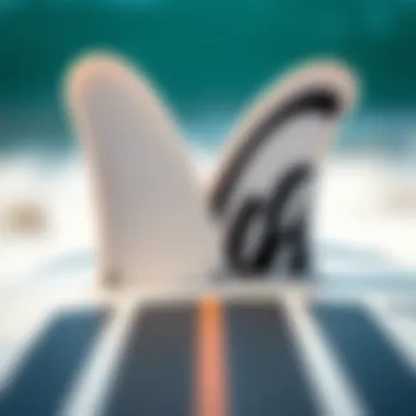 Close-up of the fins and bottom design of a Catch Surf funboard