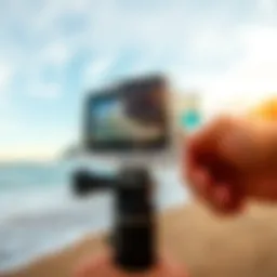 Close-up of a GoPro handheld mount in action on the beach.