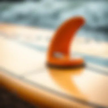 A close-up of a surfboard showcasing its design and materials, representing the evolution of surfboarding gear.