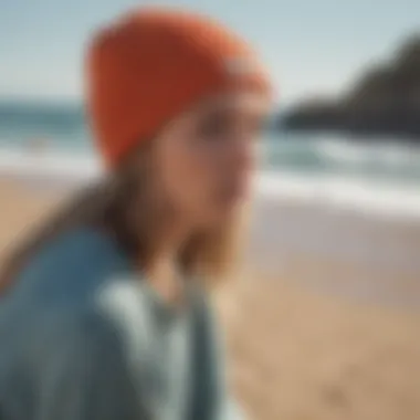 A fashionable surfer wearing a beanie on the beach