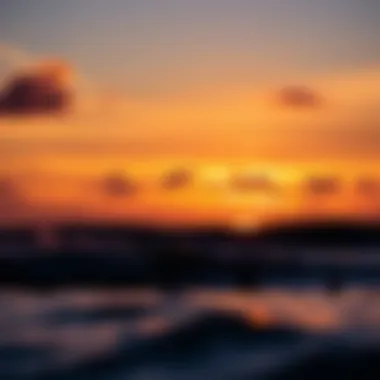 Sunset Over the Ocean with Surfing Silhouettes A breathtaking sunset over the ocean with surfing silhouettes