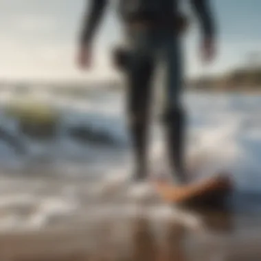 Surfer navigating waves while wearing surf waders