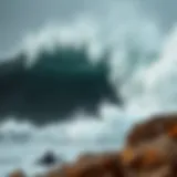 A powerful wave crashing against a rocky shore during a stormy day.