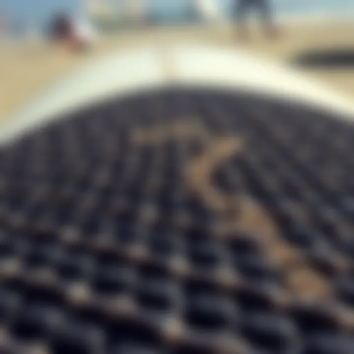 Close-up view of a textured surfboard deck pad showcasing its grip features.
