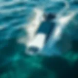 A sleek motorized surfboard gliding over crystal clear waves