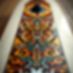 A close-up view of a long skateboard deck showcasing intricate designs and materials.