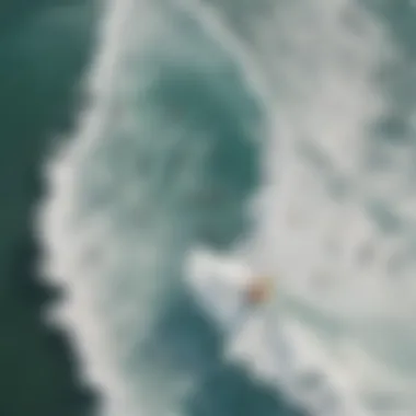 Aerial Perspective of Surfing Action Aerial view of surfers catching waves