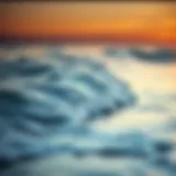 Tranquil ocean waves lapping against the shore at sunset