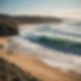 Scenic view of Witsands beach with surfers catching waves